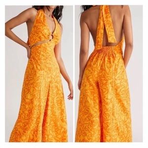 Free people orange Helter jumpsuit wide leg size M
NWT new with Tag